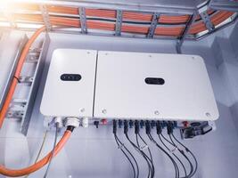 Instalation control of inverters solar panel on the wall. Technology of solar energy with shiny light. photo