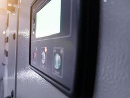 Close up of the side view a Display control on the electrical switch gear panel in power plant. photo
