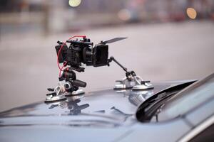 A professional camera rig is mounted on a vehicle, ready for filming cinematic projects and advertisements on the go photo