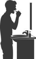 silhouette man brushing his teeth in front of the sink black color only vector