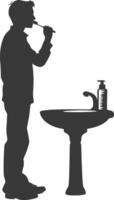 silhouette man brushing his teeth in front of the sink black color only vector