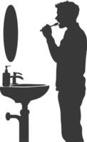 silhouette man brushing his teeth in front of the sink black color only vector