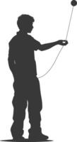 silhouette man playing yoyo game full body black color only vector
