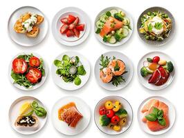 Various plates of food on a white background photo
