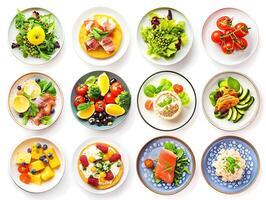 Various plates of food on a white background photo