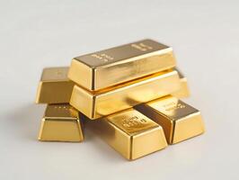 Stacks of gold bars on white background photo
