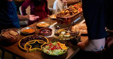 In this captivating aerial view, delicious food adorned with Ramadan decorations, including dates and meat, awaits the arrival of an European Islamic family, promising a festive and flavorful iftar photo
