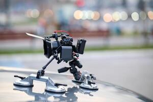 A professional camera rig is mounted on a vehicle, ready for filming cinematic projects and advertisements on the go photo