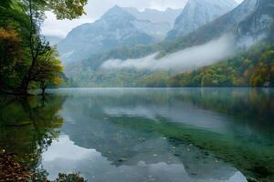Lake in foreground with mountains in background photo
