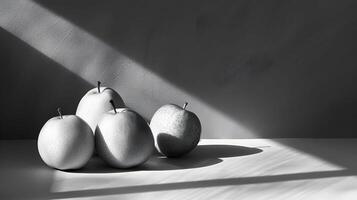 Three pears and two apples on table photo