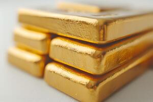 A close up of a stack of gold bars on a table photo