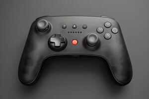 A black game controller with red buttons on a grey surface photo