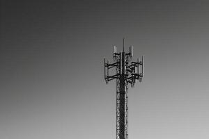 Cell tower with multiple antennas on top photo