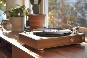A record player on a table with a plant in the background photo