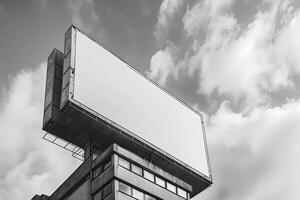 Billboard on top of a building with a cloudy sky photo