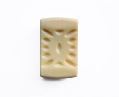 Yellow soap with blank label with color on gray background photo