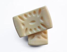 Yellow soap with blank label with color on gray background photo
