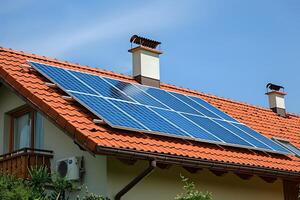A close up of a house with a solar panel on the roof photo