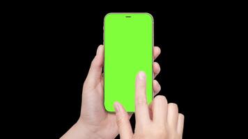 A woman's hand holds a phone chromakey Mockup and the second hand with a finger scrolls. Isolated on black background animation 4k video