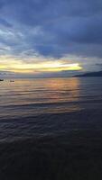 Vertical Aerial Footage of Ocean Waves at Sunset. Aerial View of the Sunset Over the Calm Ocean Wave video