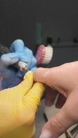 Manicure. A manicurist shapes nails using a nail file. Confident movements of a professional. video