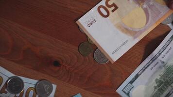 Male Hands Counting a Stack of 100 Dollar Bills on Blurred Money Background. Stack of banknotes in 10000 american dollars currency strap for hundreds. Investments in cryptocurrency. Capital. Wealth. video