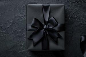 Black Gift Box Ribbon Dark Backdrop Minimalistic Concept Top View photo