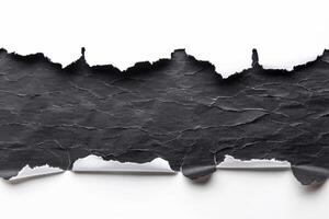 Torn black paper arranged in flat lay style on pristine white background. Ripped banner concept photo