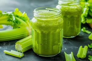 Two jars of celery juice with celery stalks photo