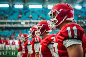 Football players in red uniforms stand in a row photo