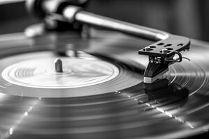 Close up of a record player's turntable with a vintage photo