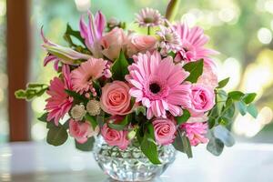Pink flowers in vase on table photo