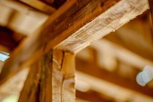 A wooden beam with a light shining through it photo