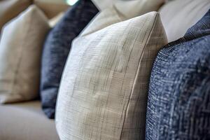 A close up of a couch with a bunch of pillows on it photo