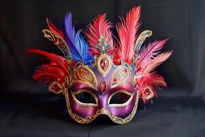 Close up of mask adorned with feathers on dark background photo