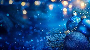 Blue christmas ornament on tree branch photo