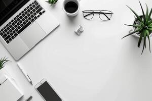 A laptop computer on a white desk photo