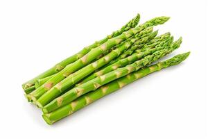 Close up of fresh asparagus spears on white surface photo
