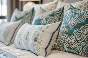Close up of bed with numerous pillows photo