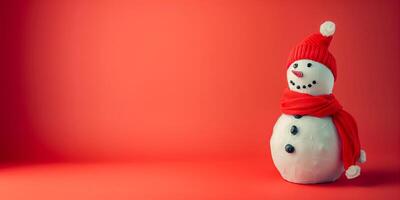 A snowman with a red scarf and hat photo