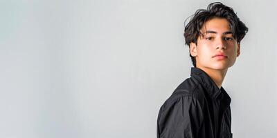 Man in a black shirt posing for a picture on a white background, banner photo