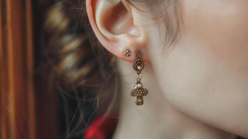 Elegant Woman Wearing Gold And Diamond Dangle Earring photo