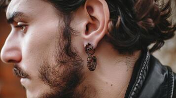 Young Man with Stylish Earring and Leather Jacket photo