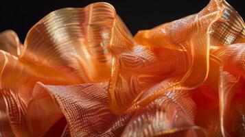 Abstract Orange Textured Fabric with Intricate Patterns and Highlights photo