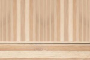 Empty wooden table over blurred wooden wall background. For product display photo