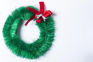 Christmas wreath with red bow isolated on white background photo