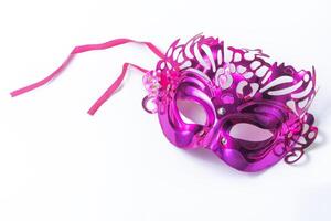Purple carnival mask isolated on white background with clipping path. photo