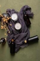 Amber and Black Dropper Bottles with Candles and Dried Flowers for Rustic Decor photo