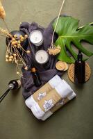 Luxury Spa Essentials with Amber Bottles, Towels, Candles, and Dried Flowers photo