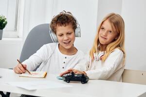 Happy siblings enjoying quality time together, capturing memories with a smartphone This cozy indoor photo